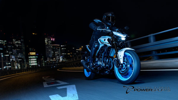 Low front view of a rider on a 2026 Yamaha MT-03 at night