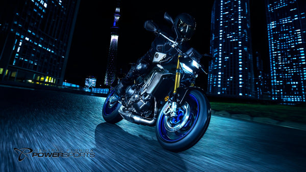 Rider on a 2026 Yamaha MT-09 SP moving through an illuminated city tunnel