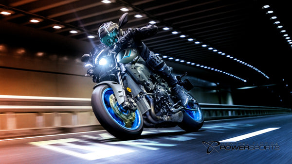 Rider leaning a 2026 Yamaha MT-10 through an illuminated tunnel