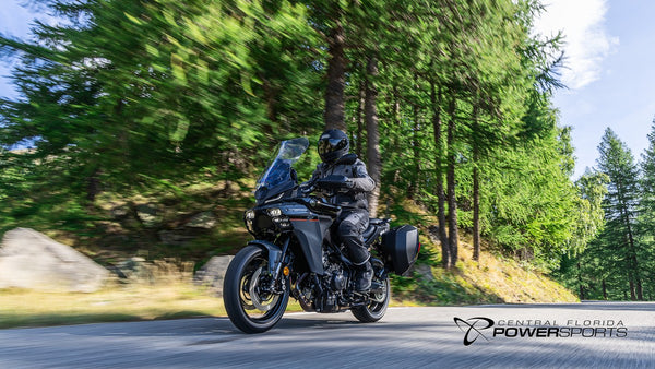 Rider on a 2026 Yamaha Tracer 9 moving along a forest road