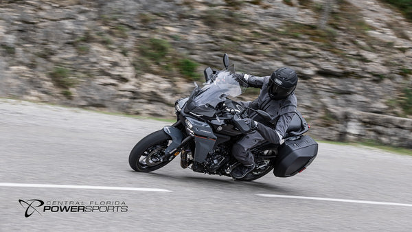 Rider cornering a 2026 Yamaha Tracer 9 on a paved mountain road