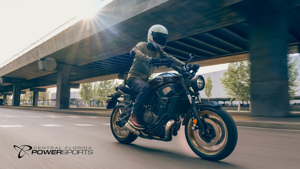Rider on a 2026 Yamaha XSR700 moving beneath an overpass