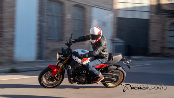 Side view of a rider on a 2026 Yamaha XSR900 in an urban setting