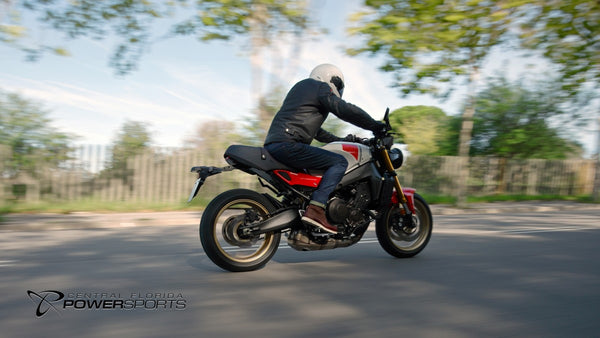 Rear three-quarter view of a rider on a 2026 Yamaha XSR900