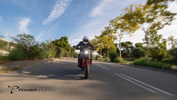 Rider approaching on a 2026 Yamaha XSR900 along a tree-lined road