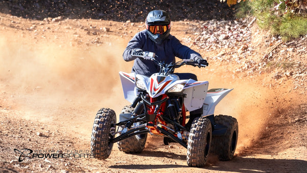 Helmeted rider on a 2026 Yamaha YFZ450R SE kicking up dust