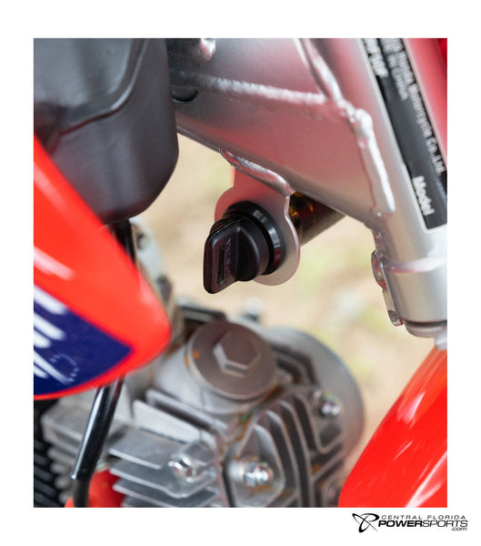 2027 Honda CRF50F ignition detail.