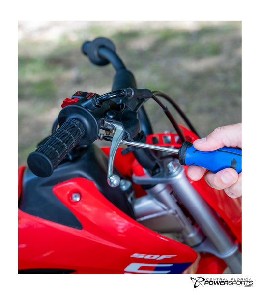 2027 Honda CRF50F throttle detail.