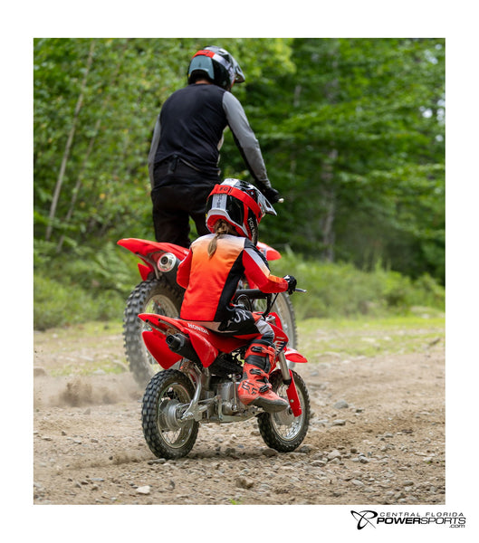 2027 Honda CRF50F in Red, rear view.