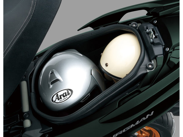 2027 Suzuki Burgman 400 under-seat storage holding two full-face helmets